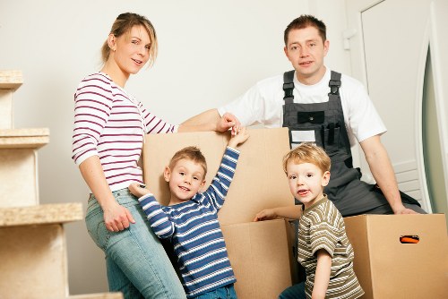 Professional movers handling furniture in a Notting Hill flat