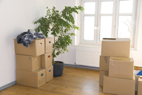 Moving team loading boxes near a townhouse in Notting Hill