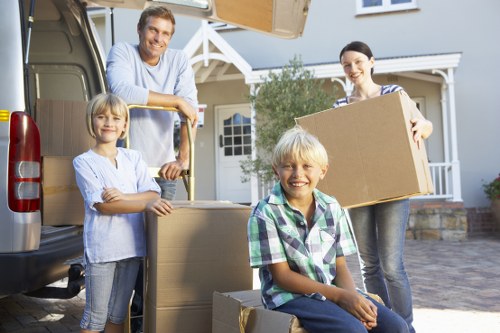 Unpacking household items in a Notting Hill flat