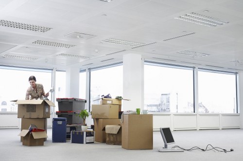 Boxes and office furniture prepared for a local business move
